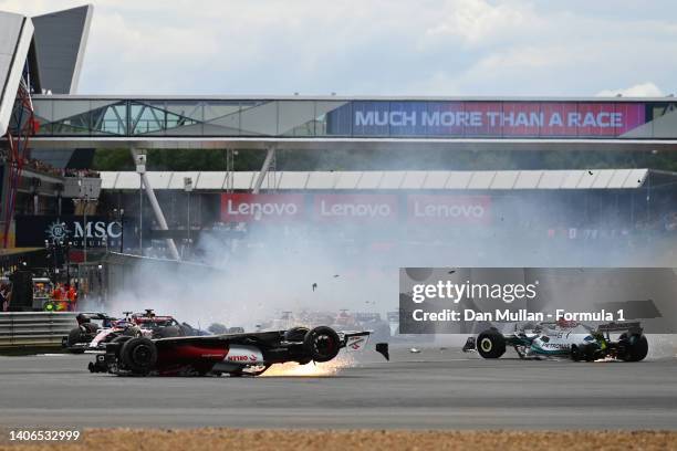 Zhou Guanyu of China driving the Alfa Romeo F1 C42 Ferrari crashes at the start during the F1 Grand Prix of Great Britain at Silverstone on July 03,...