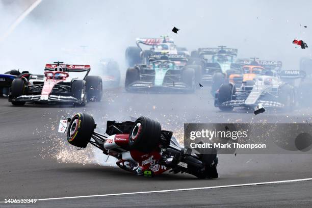 Zhou Guanyu of China driving the Alfa Romeo F1 C42 Ferrari crashes at the start during the F1 Grand Prix of Great Britain at Silverstone on July 03,...