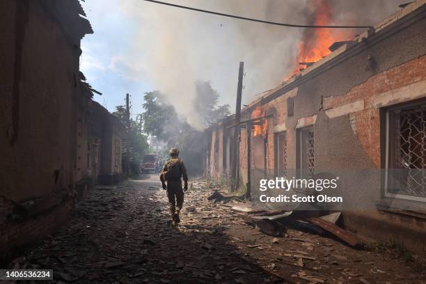 Fire burns at a shopping mall after it was struck by a missile on July 03, 2022 in Sloviansk, Ukraine. The attack was one of many in the city early...