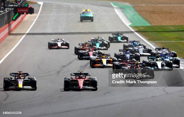 Max Verstappen of the Netherlands driving the Oracle Red Bull Racing RB18 and Carlos Sainz of Spain driving the Ferrari F1-75 battle for track...