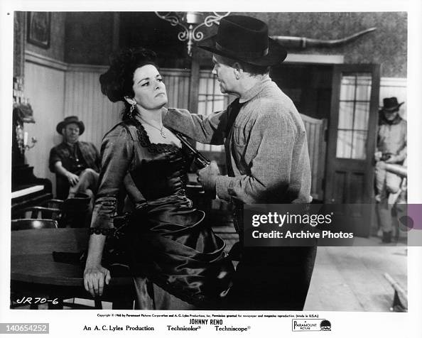 Jane Russell is held at gunpoint by Lyle Bettger in a scene from the ...
