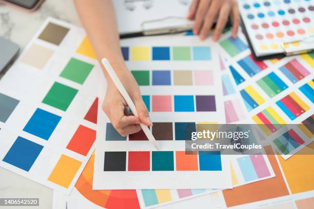 graphic designer at work. color swatch samples. artist drawing something on graphic tablet at the office. graphic designer creativity editor ideas designer concept - farbpalette stock-fotos und bilder