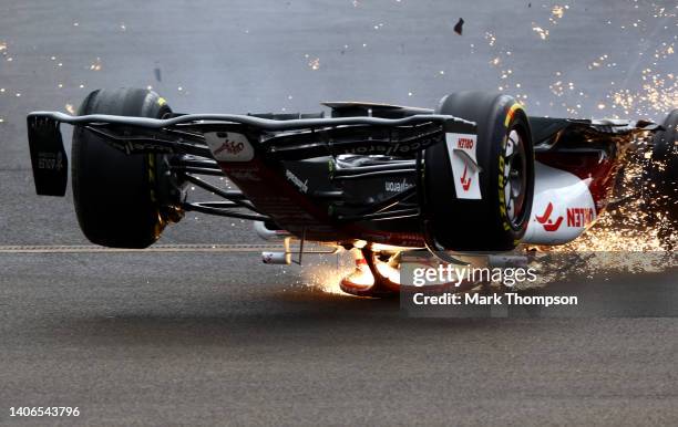 Zhou Guanyu of China driving the Alfa Romeo F1 C42 Ferrari crashes at the start during the F1 Grand Prix of Great Britain at Silverstone on July 03,...