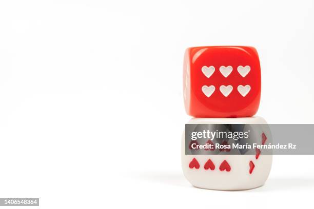 two game dice with heart shaped  on white background. - number 2 stock-fotos und bilder