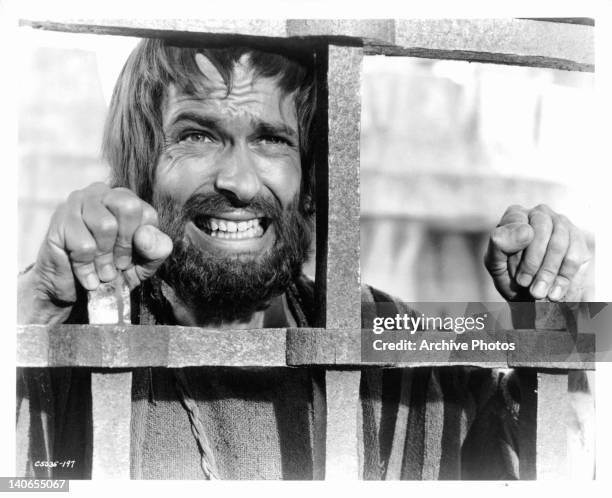 Rip Torn cringes as he hears the last of the whip as Jesus is prepared for the crucifixion in a scene from the film 'King Of Kings', 1961.