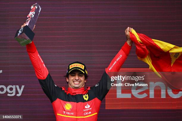 Race winner Carlos Sainz of Spain and Ferrari celebrates on the podium during the F1 Grand Prix of Great Britain at Silverstone on July 03, 2022 in...