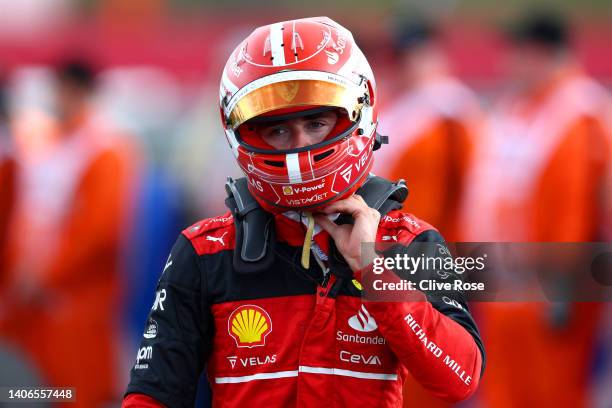 Charles Leclerc of Monaco and Ferrari looks on in parc ferme during the F1 Grand Prix of Great Britain at Silverstone on July 03, 2022 in...