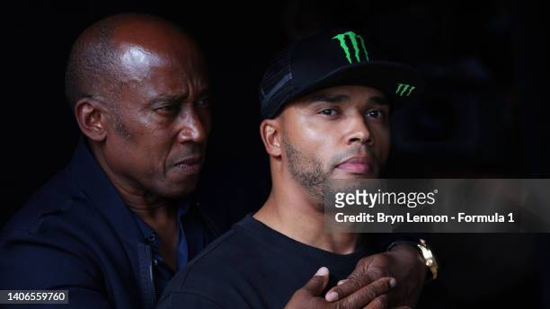 Lewis Hamilton of Great Britain and Mercedes' father, Anthony Hamilton and brother, Nicolas Hamilton look on in parc ferme after the F1 Grand Prix of...
