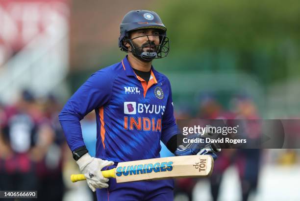 Dinesh Karthik of India walks off the pitch after being caught by Ricardo Vasconcelos during the T20 Tour match between Northamptonshire and India at...