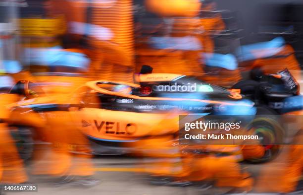 Daniel Ricciardo of Australia driving the McLaren MCL36 Mercedes comes in for a pit stop during the F1 Grand Prix of Great Britain at Silverstone on...