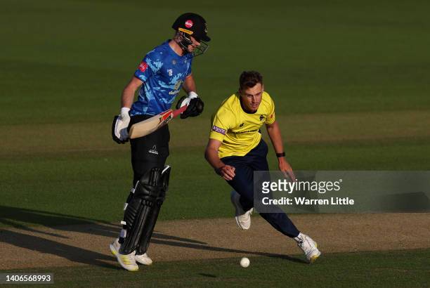 Brad Wheal of Hampshire hawks crosses paths George Gaton of Susses Sharks on the wicket during the Vitality T20 Blast match between Sussex Sharks and...
