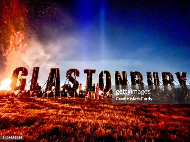 The Glastonbury sign is seen against the night sky at the 2022 Glastonbury Festival during day two of Glastonbury Festival at Worthy Farm, Pilton on...