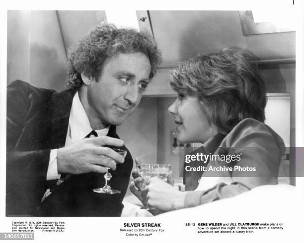 Gene Wilder and Jill Clayburgh make plans on how to spend the night together in a scene from the film 'Silver Streak', 1976.