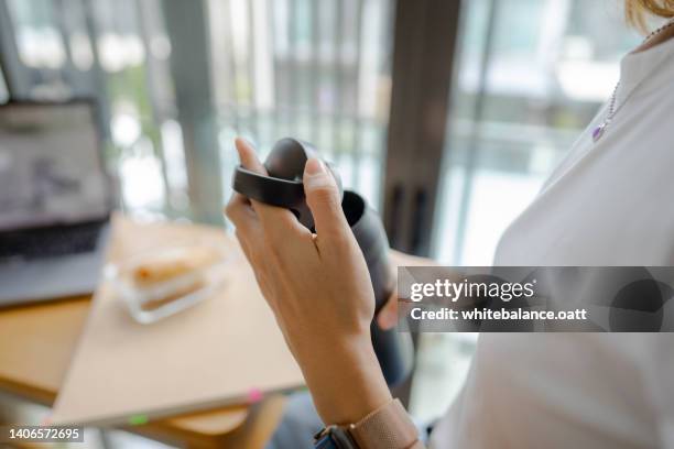 young graphic designers talking casually while taking a break together. - reusable water bottle office stock pictures, royalty-free photos & images