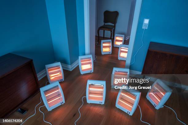 room filled with electric infrared heaters (quartz heaters) - electric heater fotografías e imágenes de stock