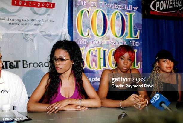 Singers Michelle Williams , Kelly Rowland and Beyoncé Knowles of Destiny's Child speaks to the press at the South Side YMCA prior to meeting and...