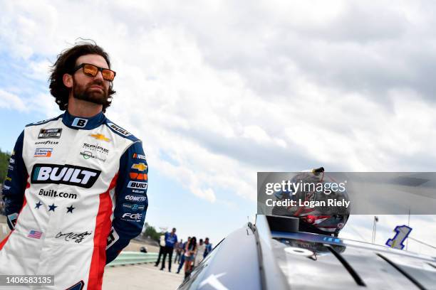 Corey LaJoie, driver of the Built.com Chevrolet, waits on the grid prior to the NASCAR Cup Series Kwik Trip 250 at Road America on July 03, 2022 in...