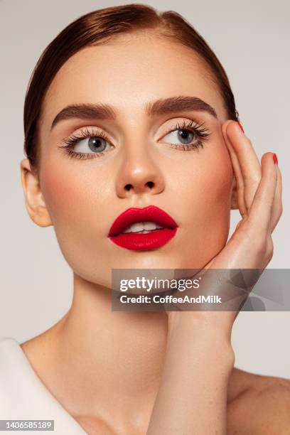 beautiful emotional woman - red lipstick stock pictures, royalty-free photos & images