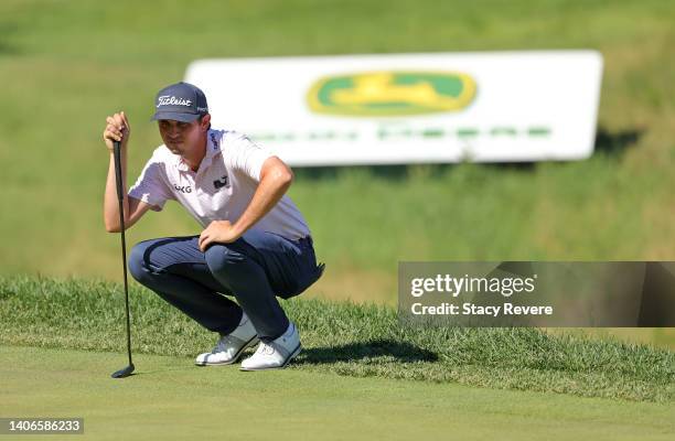 Poston of the United States lines up a putt on the 16th green during the final round of the John Deere Classic at TPC Deere Run on July 03, 2022 in...