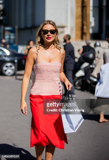 Veronica Ferraro seen wearing rose red two tone dress, heels, bag outside Paco Rabanne during Paris Fashion Week on July 03, 2022 in Paris, France.