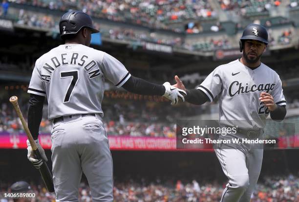 Leury Garcia of the Chicago White Sox celebrates scoring with Tim Anderson against the San Francisco Giants in the top of the fourth inning at Oracle...