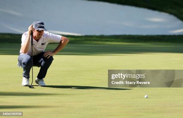 Poston of the United States lines up a putt on the 18th green during the final round of the John Deere Classic at TPC Deere Run on July 03, 2022 in...