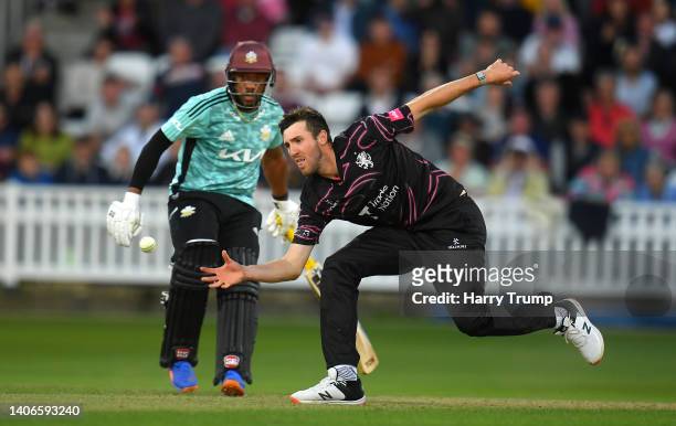 Craig Overton of Somerset gathers the ball during the Vitality T20 Blast match between Somerset and Surrey at The Cooper Associates County Ground on...