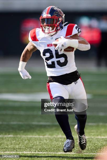 Walter Fletcher of the Montreal Alouettes runs with the ball during the game between the Montreal Alouettes and the Saskatchewan Roughriders at...