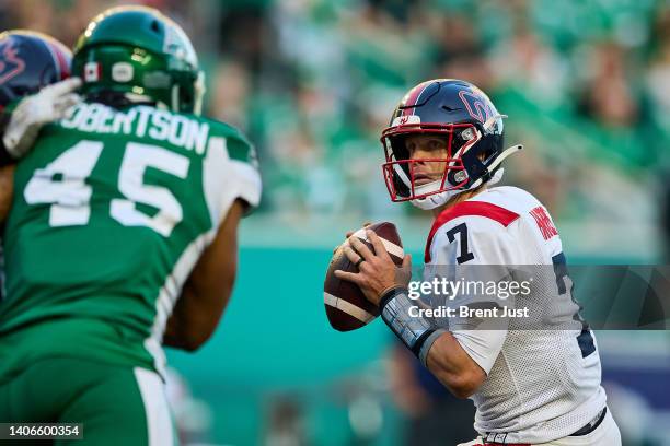 Trevor Harris of the Montreal Alouettes looks to throw a pass in the game between the Montreal Alouettes and the Saskatchewan Roughriders at Mosaic...