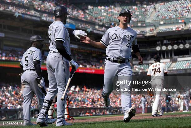 Seby Zavala of the Chicago White Sox celebrates after scoring in the top of the eighth inning with Luis Robert against the San Francisco Giants at...