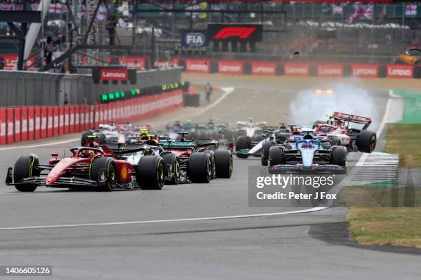 The crash of Guanyu Zhou of Alfa Romeo and China and George Russell of Mercedes and Great Britain begins during the F1 Grand Prix of Great Britain at...