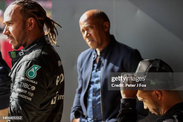 Lewis Hamilton of Mercedes and Great Britain with his father Anthony Hamilton and brother Nicolas Hamilton in parc ferme during the F1 Grand Prix of...