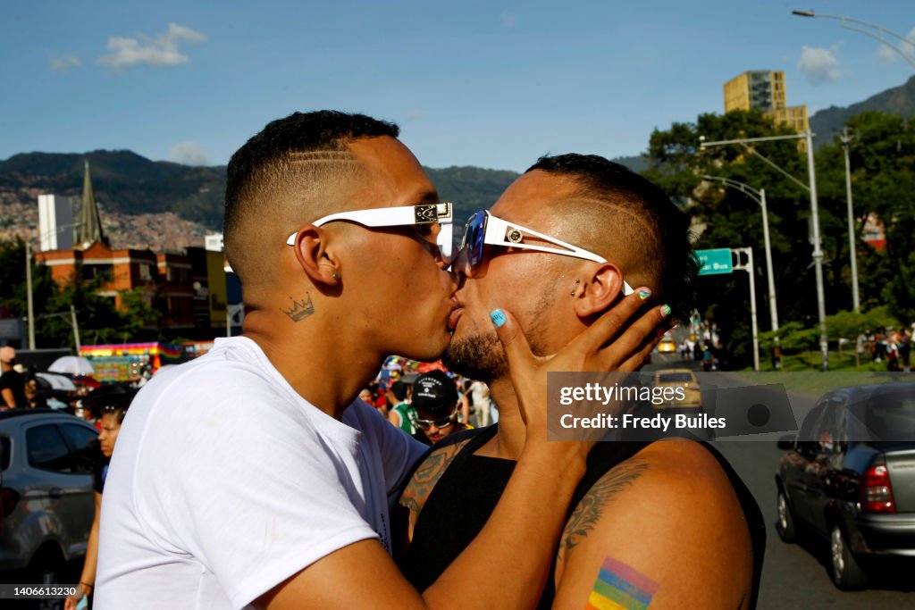A gay couple kisses during the Medellin Pride Parade on July 03, 2025