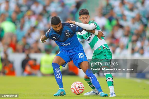 Rodrigo Aguirre of Monterrey struggles for the ball with Omar Campos of Santos during the 1st round match between Santos Laguna and Monterrey as part...