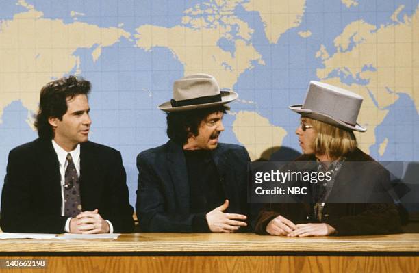 Episode 14 -- Pictured: Dennis Miller, Dana Carvey as Bob Dylan, David Spade as Tom Petty during the 'Weekend Update' skit on February 23, 1991 --...
