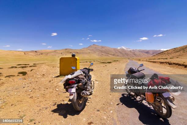 riding through moore plains ladakh, india - motorcycle travel stock pictures, royalty-free photos & images