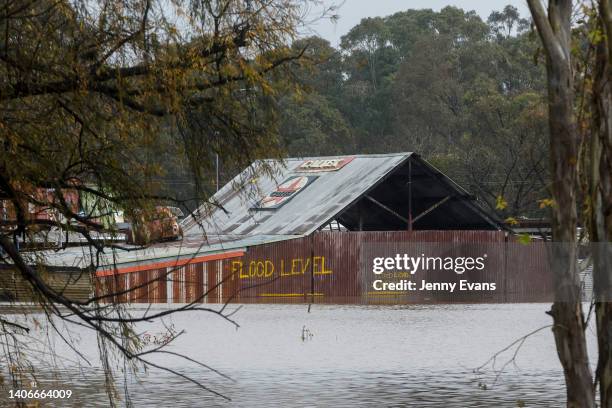 Buildings are seen inundated by floodwaters along the Hawkesbury River in the suburb of Windsor, on July 04, 2022 in Sydney, Australia. Thousands of...