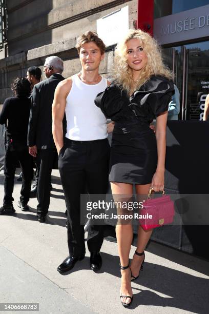 Oliver Cheshire and Pixie Lott attend the Schiaparelli Couture Fall Winter 2022 2023 show as part of Paris Fashion Week on July 04, 2022 in Paris,...
