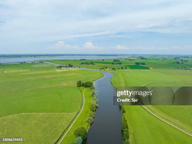 rural landscape with a river through the meadows seen from above - netherlands aerial stock pictures, royalty-free photos & images