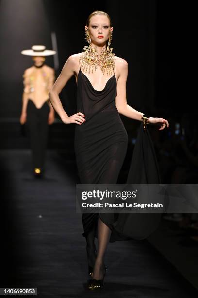 Model walks the runway during the Schiaparelli Haute Couture Fall Winter 2022 2023 show as part of Paris Fashion Week on July 04, 2022 in Paris,...