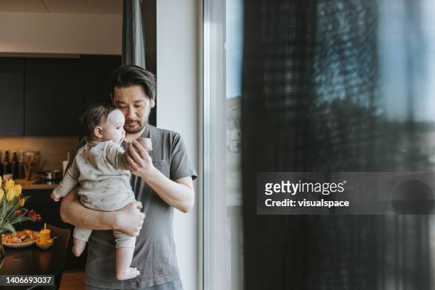 father and baby daughter spending time together - house husband stock pictures, royalty-free photos & images