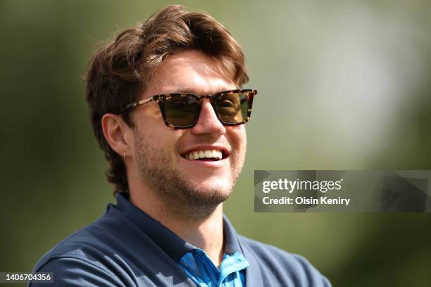 Recording artist Niall Horan shares a joke at the 11th tee during Day One of the JP McManus Pro-Am at Adare Manor on July 04, 2022 in Limerick,...