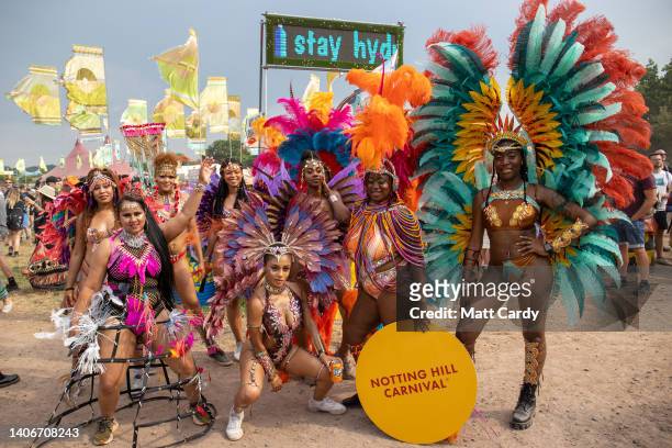 Members of the Notting Hill carnival dance at the 2022 Glastonbury Festival during day two of Glastonbury Festival at Worthy Farm, Pilton on June 23,...