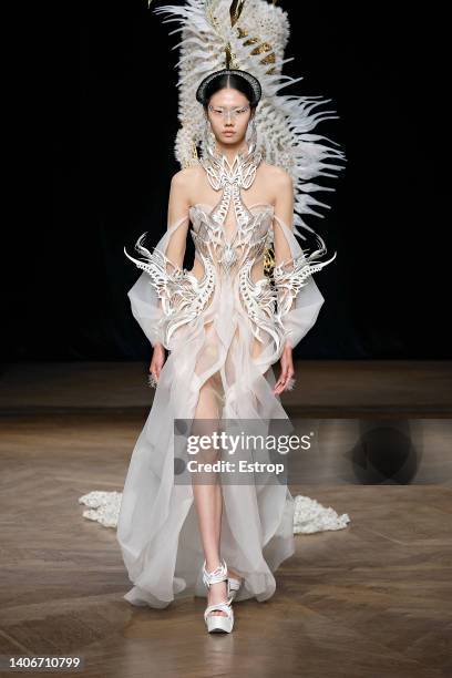 Model walks the runway during the Iris Van Herpen Haute Couture Fall Winter 2022 2023 show as part of Paris Fashion Week on July 4, 2022 in Paris,...