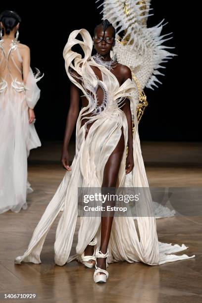 Model walks the runway during the Iris Van Herpen Haute Couture Fall Winter 2022 2023 show as part of Paris Fashion Week on July 4, 2022 in Paris,...