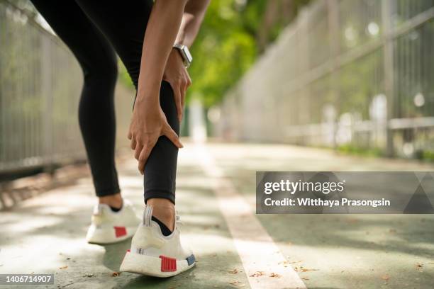 this leg injury keeps acting up - female muscle calves stock pictures, royalty-free photos & images