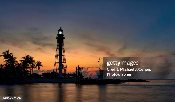 panorama of dawn at hillsboro lighthouse - pompano beach stock-fotos und bilder