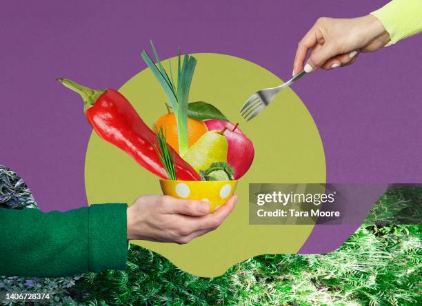 eating bowl of vegetables - tenedor fotografías e imágenes de stock