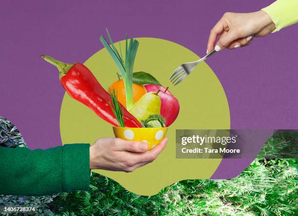 eating bowl of vegetables - vegan foto e immagini stock