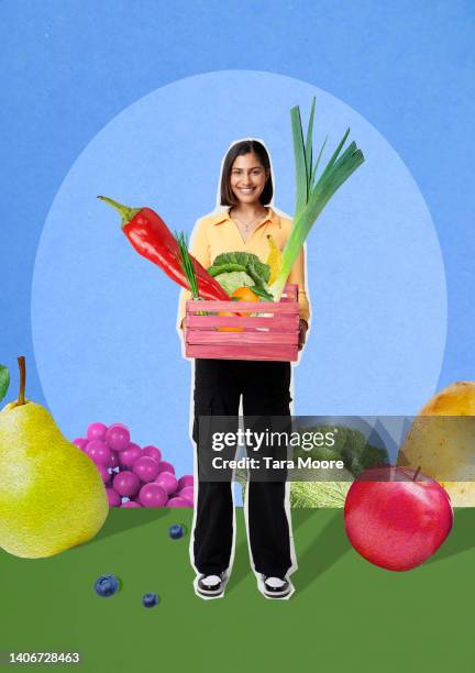 woman holding box of fruit and vegetables - veganes essen stock-fotos und bilder